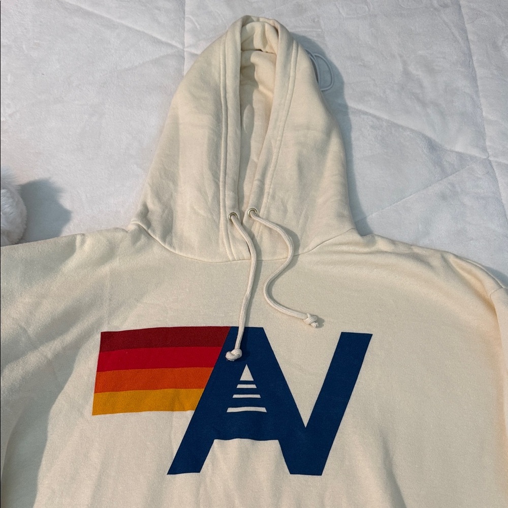 Aviator Nation Cream Hoodie with Bold Multicolor Logo